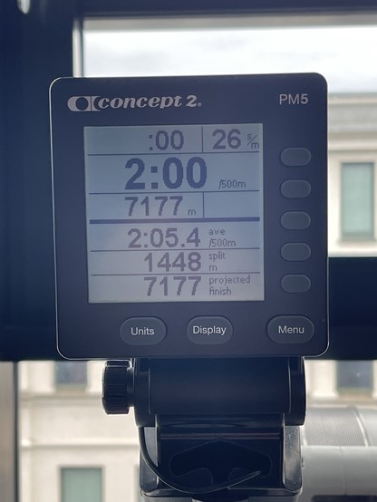 A Concept2 PM5 rowing machine monitor displaying workout data including time, distance, and average split time.