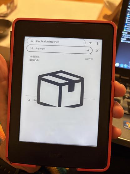 Kindle ebook reader in the process of installing a software package. A big parcel can be seen in the middle of the screen. Some smaller text on the top. 